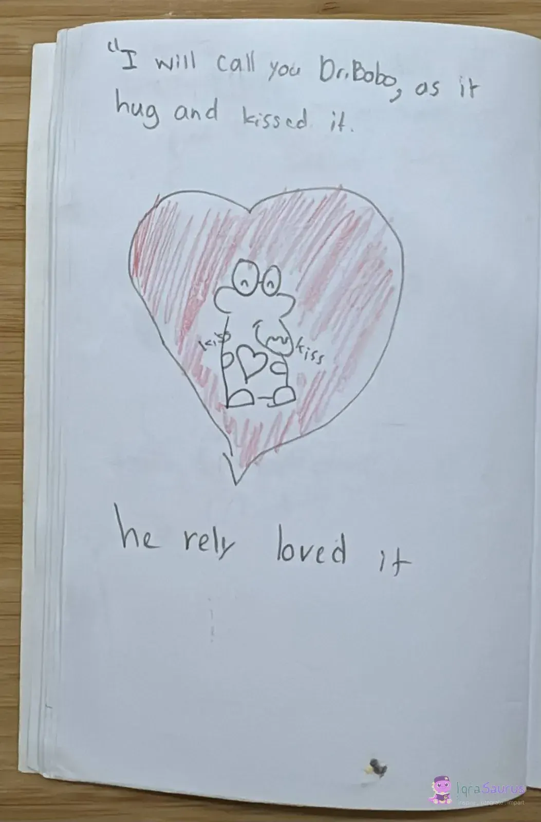 Inside a red heart, the Gruffalo hugs a heart shape with the word kiss on both sides.